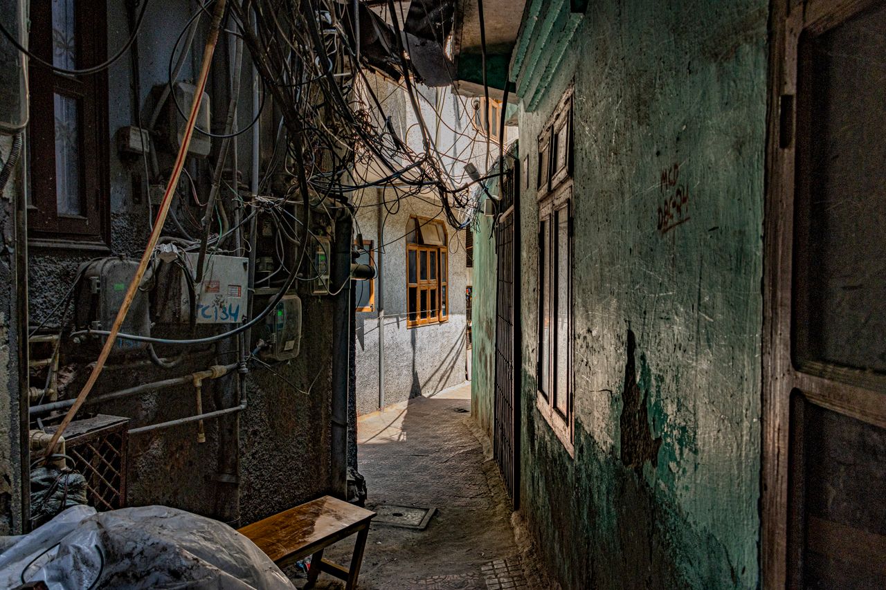 Explore the textured alleys of Majnu Ka Tilla, featuring rustic charm and architecture.